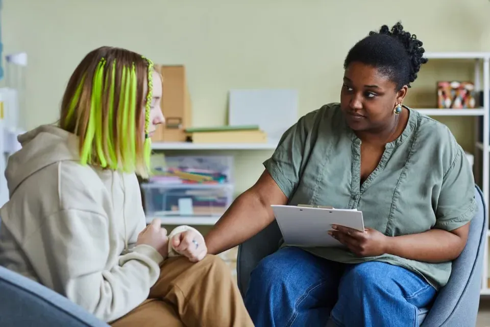 Social Worker Speaking with Young Client